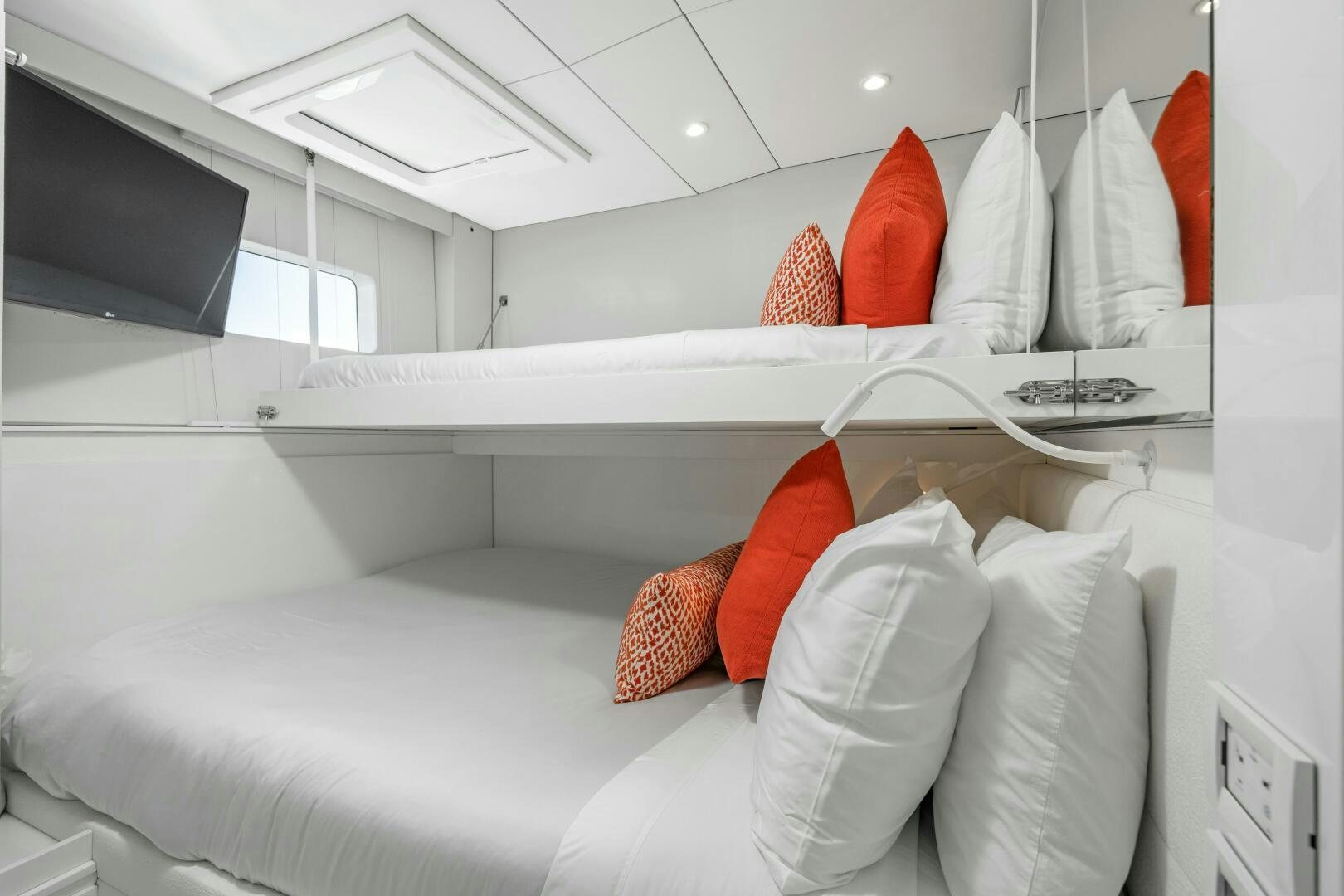 a white bed with pillows aboard ROYAL RITA Yacht for Sale