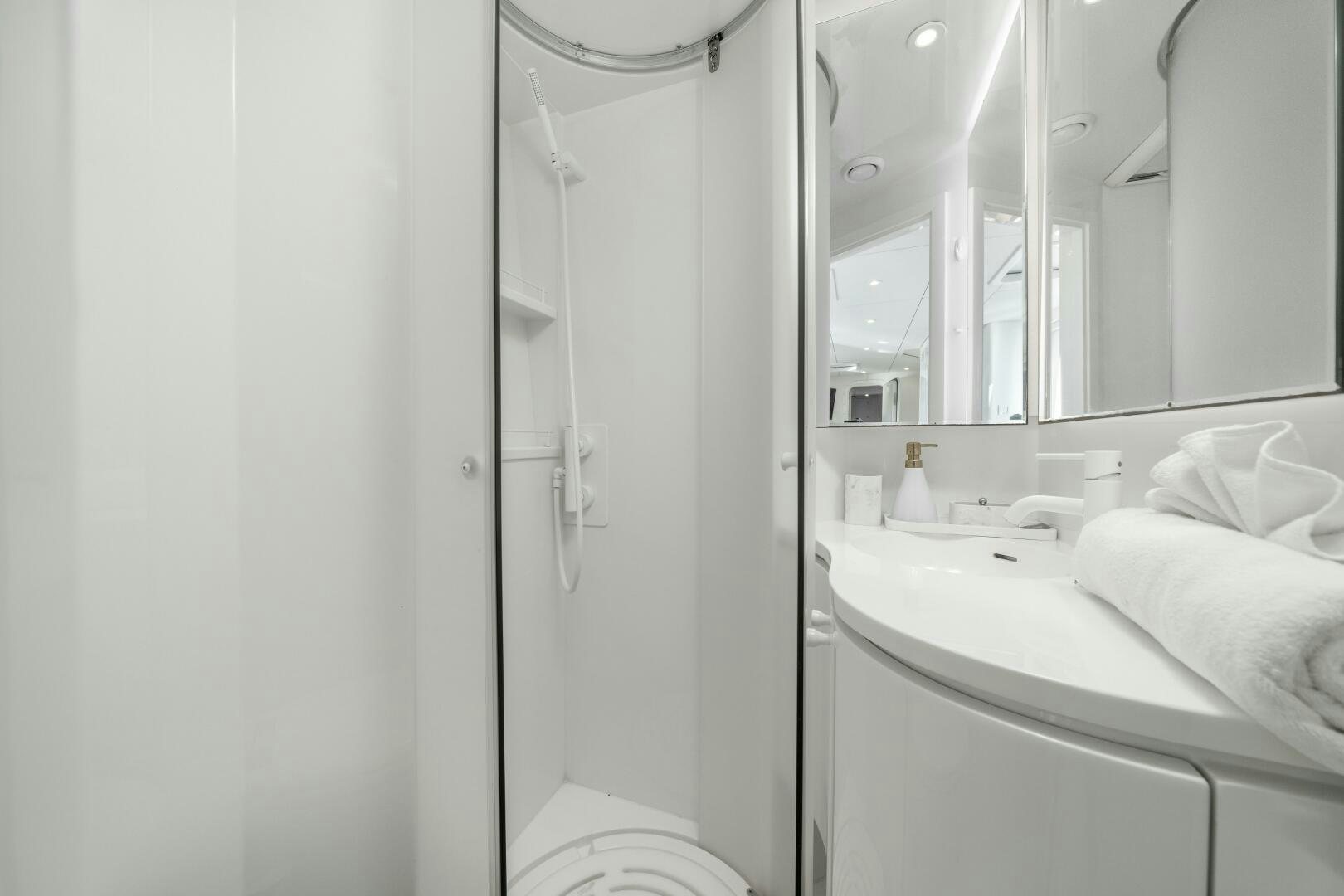 a bathroom with a sink and a mirror aboard ROYAL RITA Yacht for Sale
