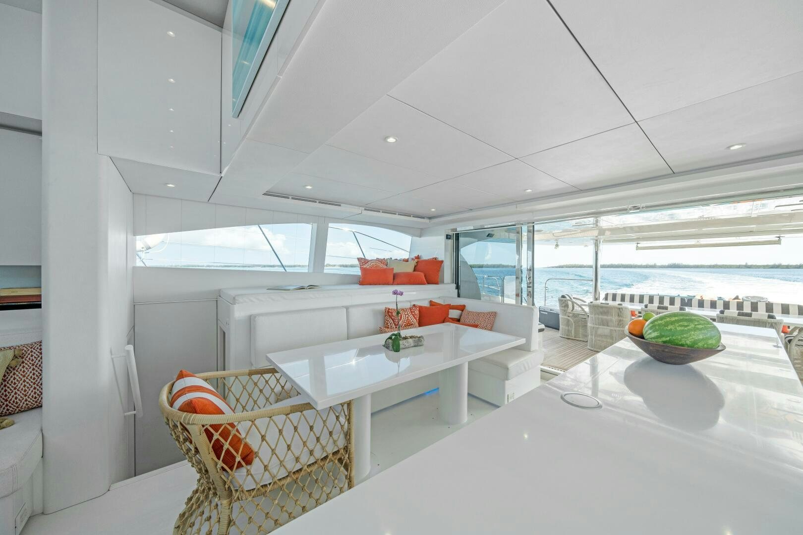 a room with a table and chairs aboard ROYAL RITA Yacht for Sale