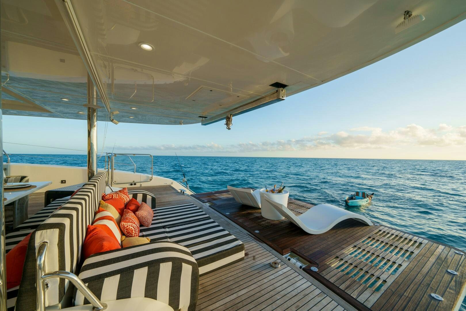 a deck with chairs and a boat on it aboard ROYAL RITA Yacht for Sale