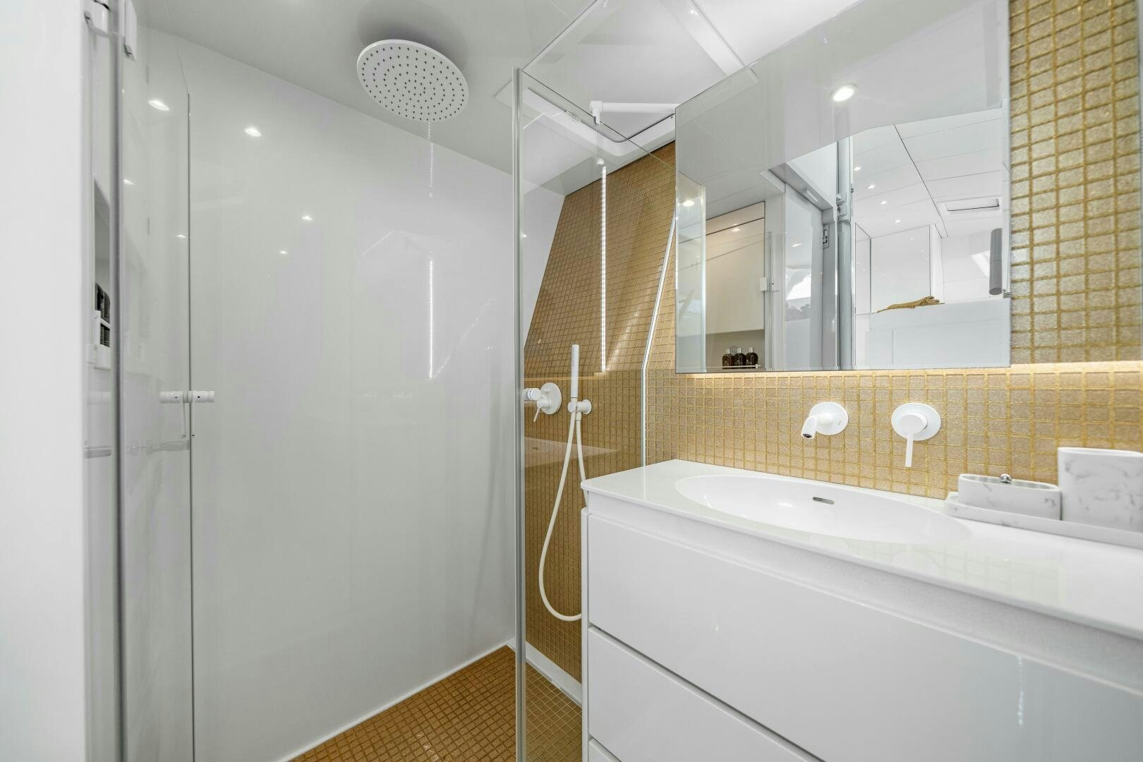 a bathroom with a shower and a sink aboard ROYAL RITA Yacht for Sale