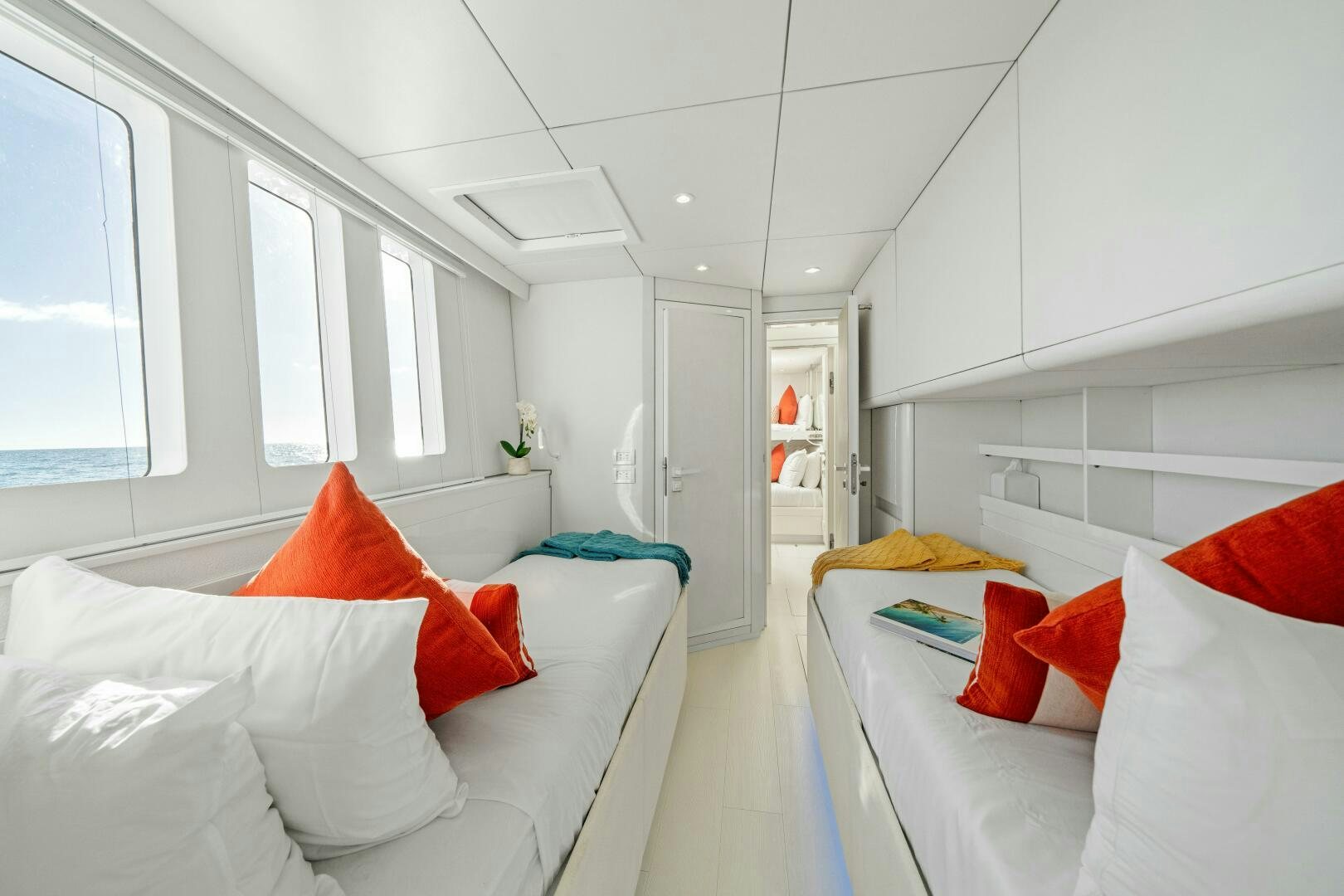 a room with white furniture aboard ROYAL RITA Yacht for Sale