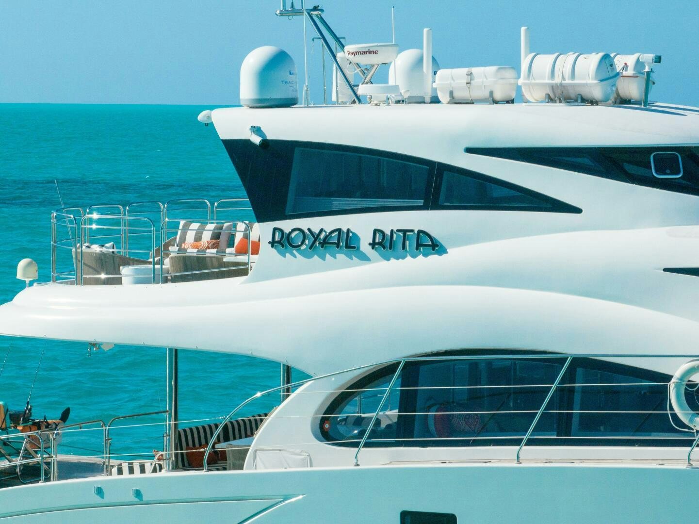 a white yacht on the water aboard ROYAL RITA Yacht for Sale
