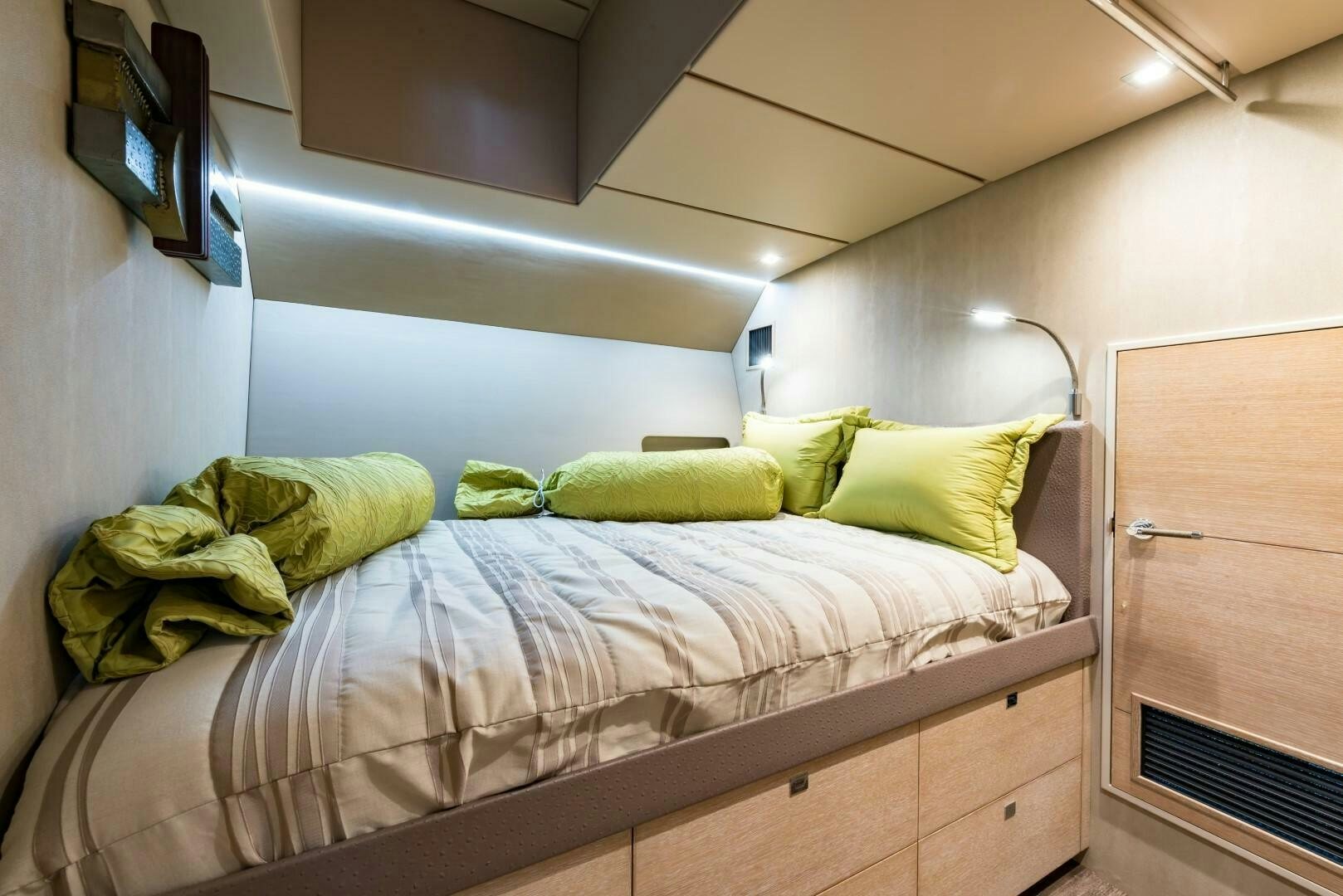 a bed with a television on the wall aboard BUFFALO NICKEL Yacht for Sale
