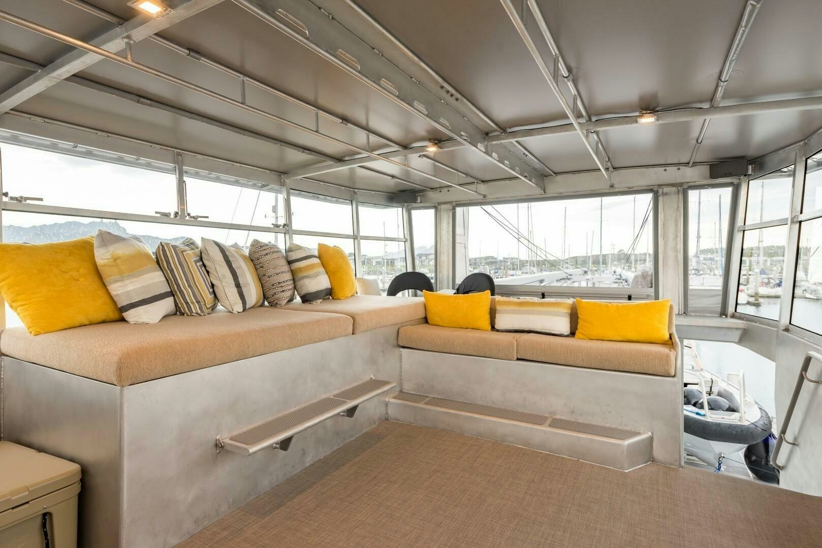 a room with couches and a table aboard BUFFALO NICKEL Yacht for Sale