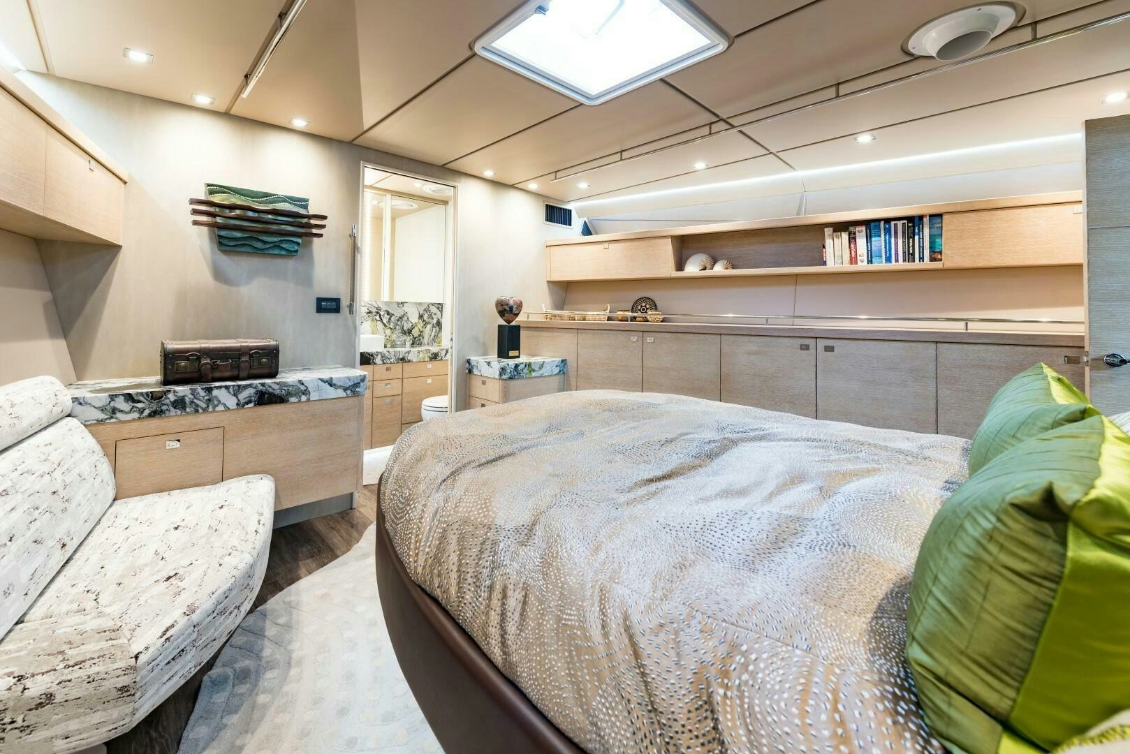 a bedroom with a bed and a desk aboard BUFFALO NICKEL Yacht for Sale