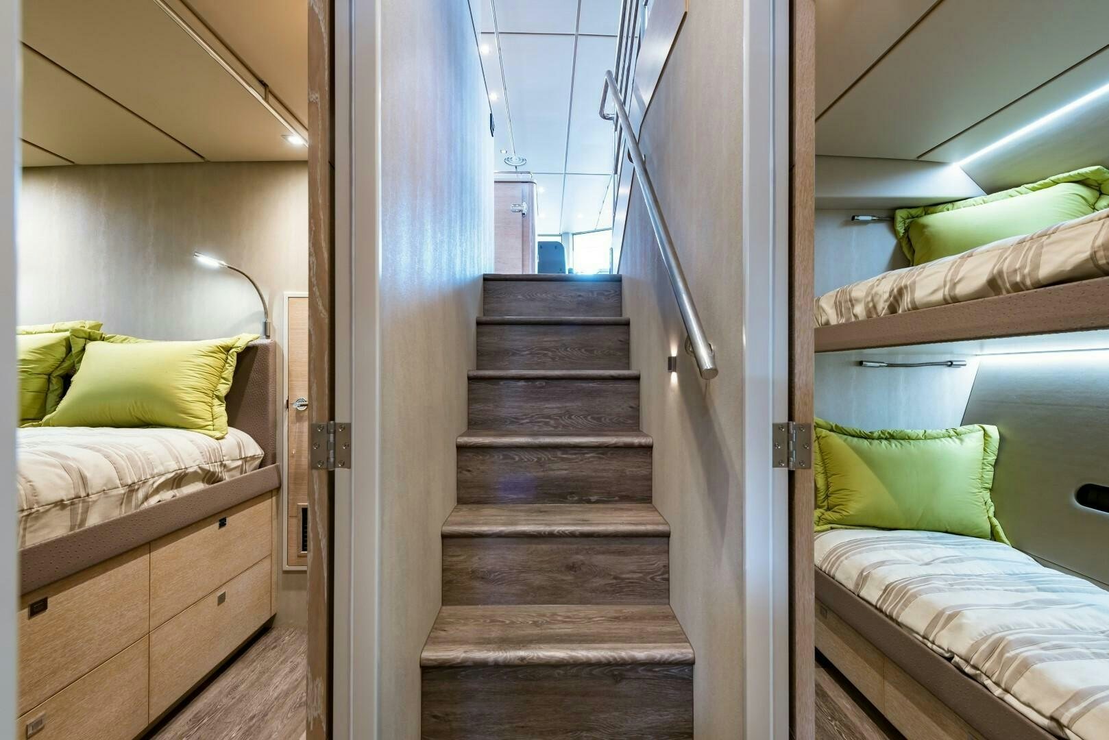 a room with a bed and a staircase aboard BUFFALO NICKEL Yacht for Sale