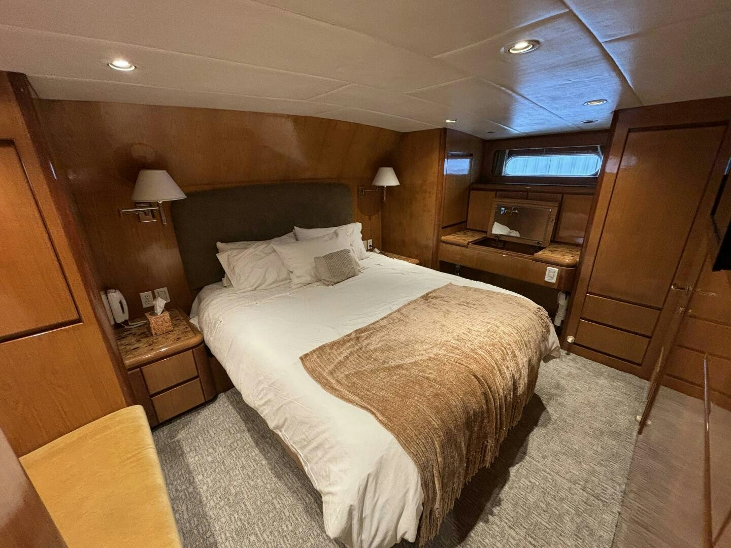 a bedroom with a bed and a desk aboard ROYAL VIKING Yacht for Sale