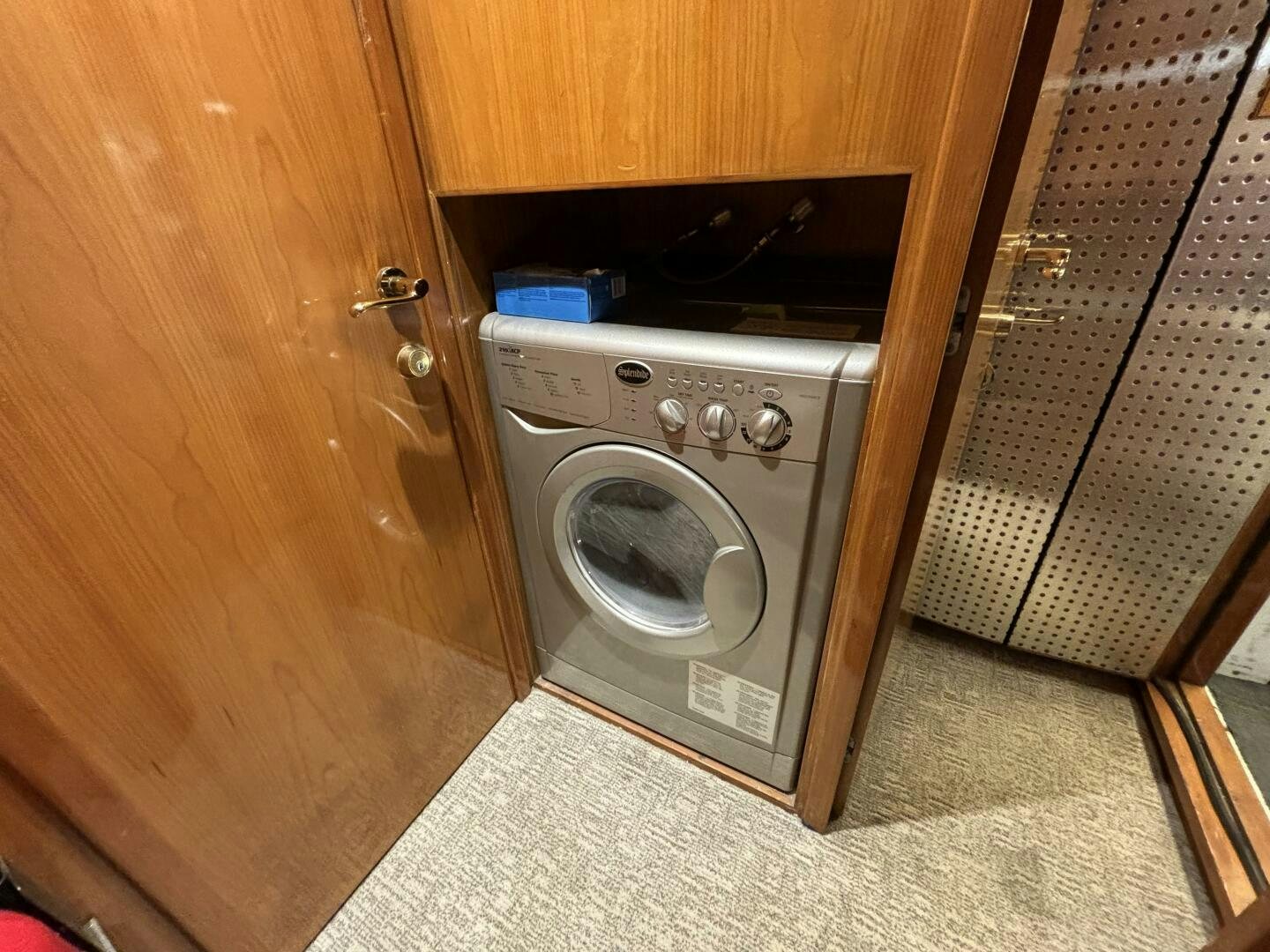 a washing machine in a room aboard ROYAL VIKING Yacht for Sale