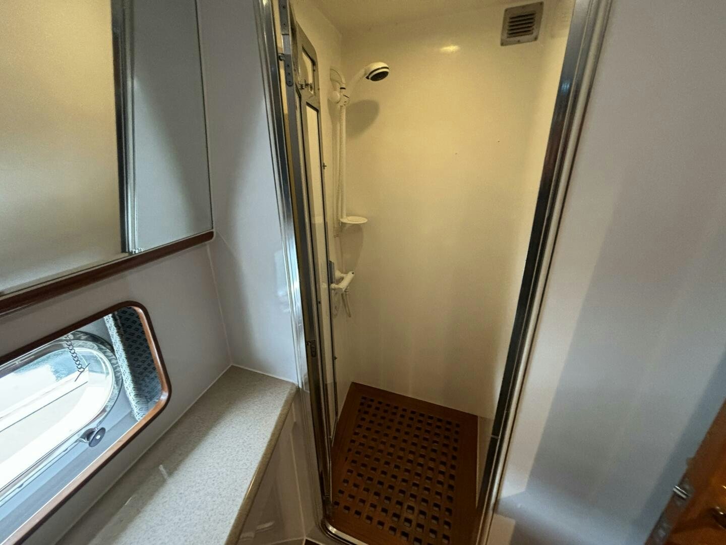 a hallway with a door and a window aboard ROYAL VIKING Yacht for Sale
