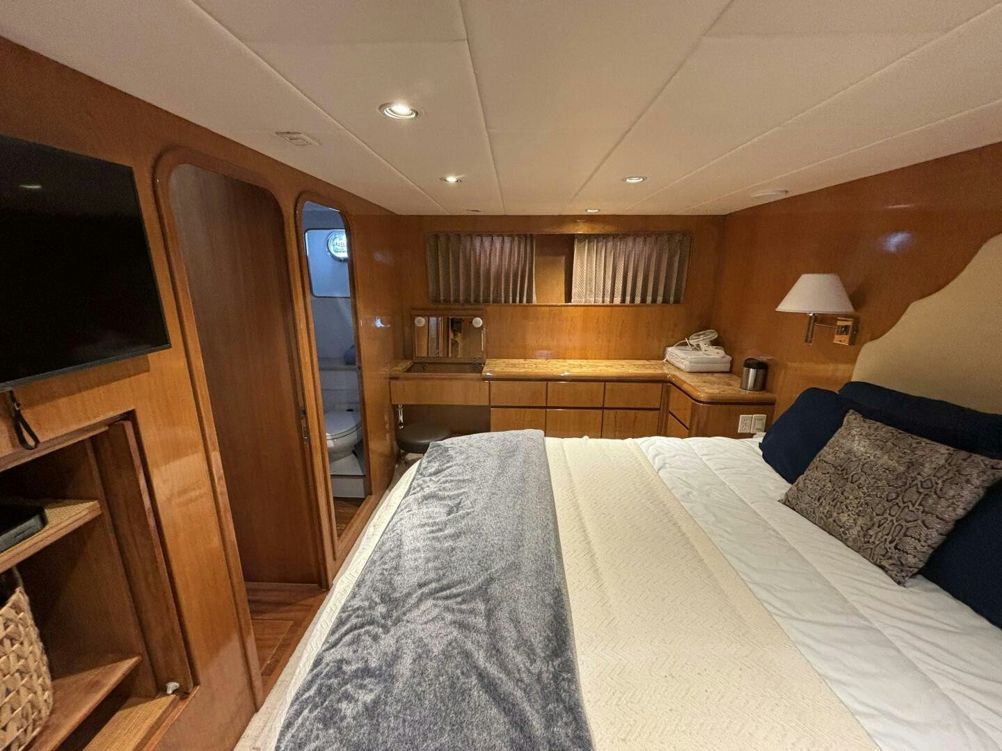 a bedroom with a bed and a shelf aboard ROYAL VIKING Yacht for Sale