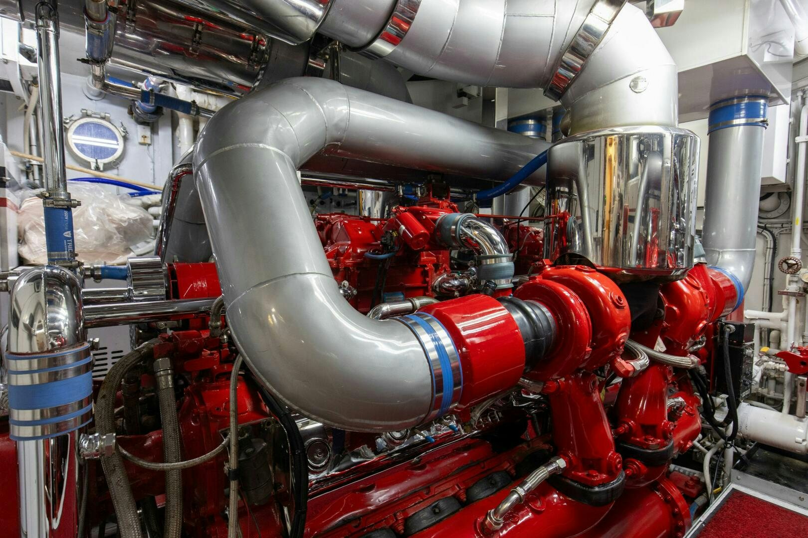 a machine with red pipes aboard BOSS Yacht for Sale