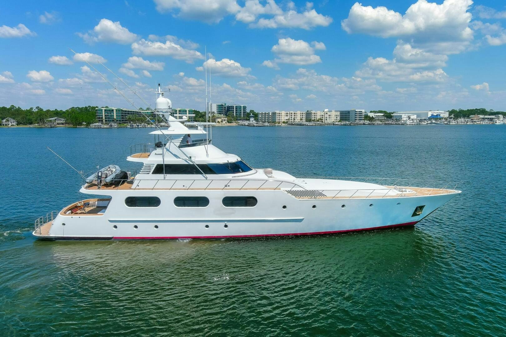 a white boat in the water aboard BOSS Yacht for Sale