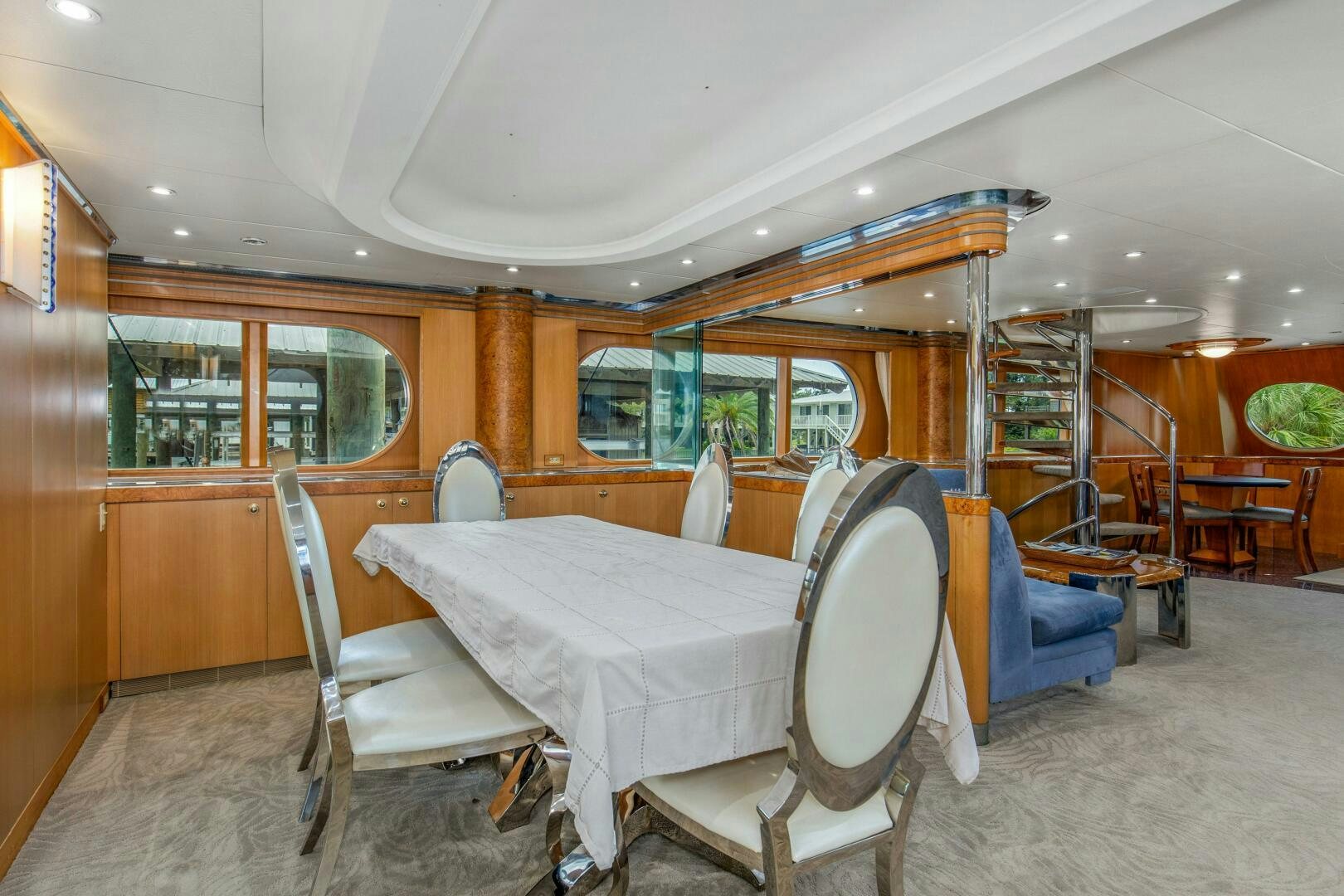 a dining room with a table and chairs aboard BOSS Yacht for Sale