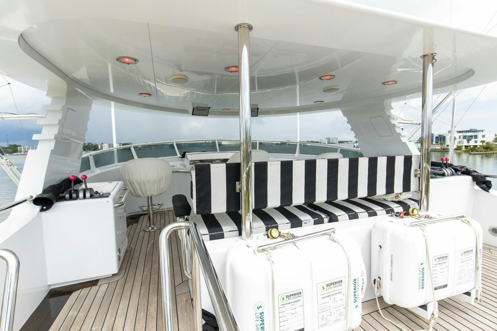 inside of a building with a white table and chairs and a white table aboard BOSS Yacht for Sale