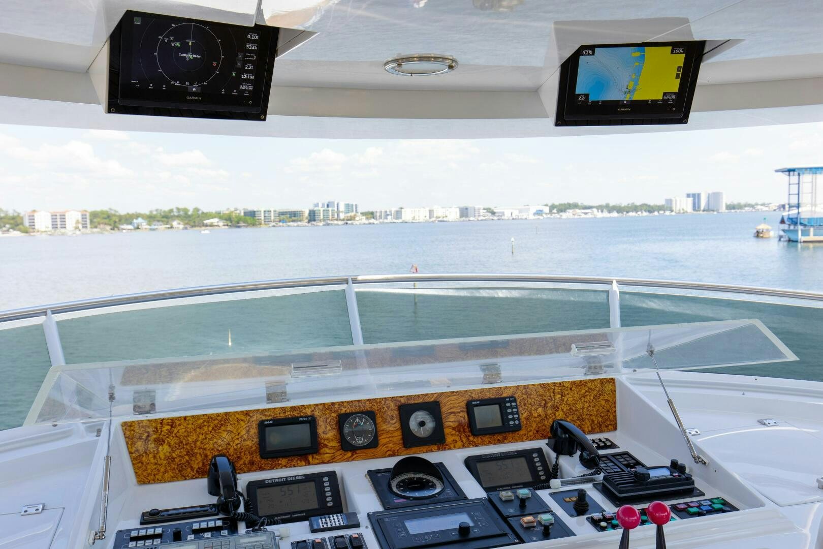 a control panel with a screen and a couple of monitors aboard BOSS Yacht for Sale