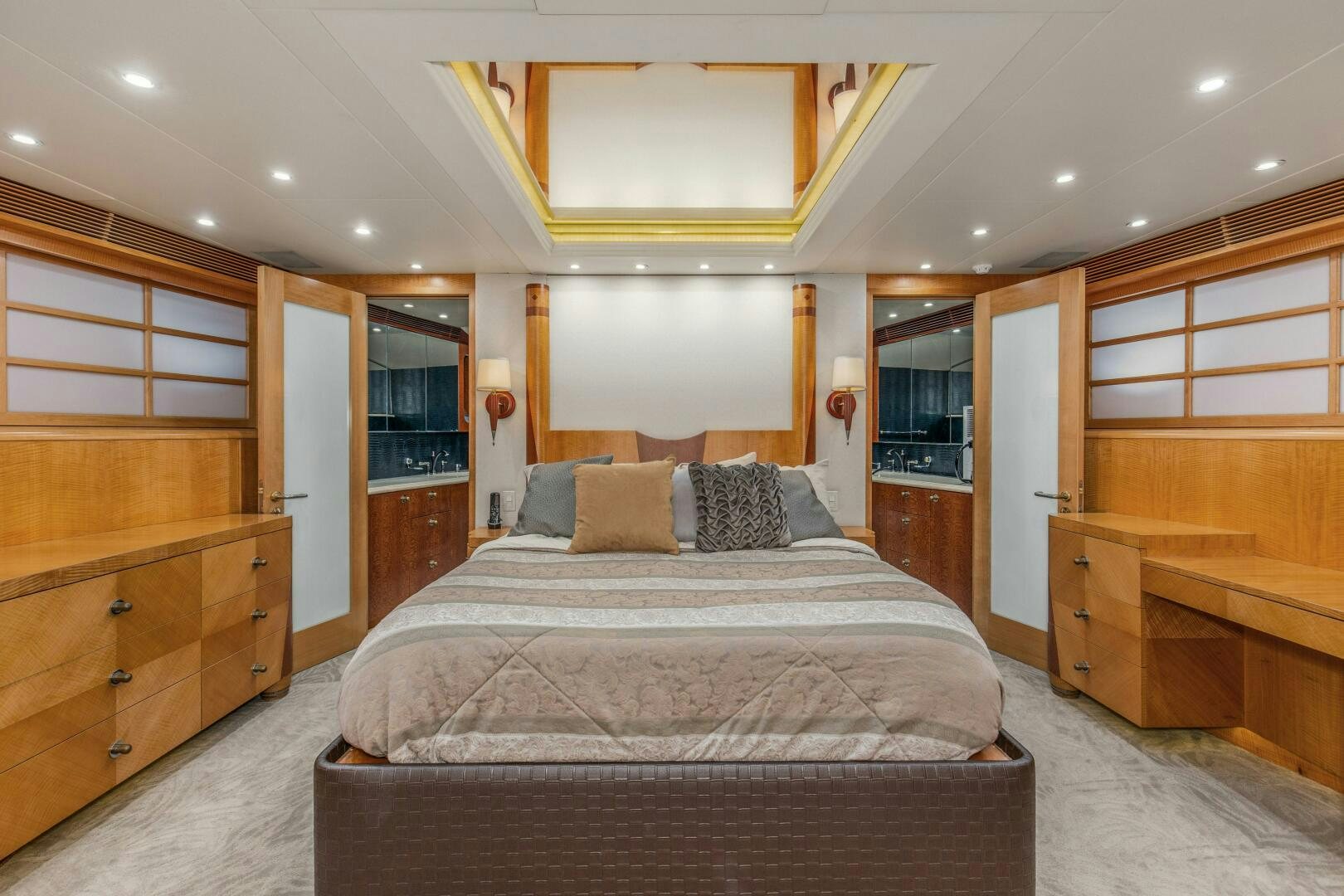 a large bedroom with a large bed aboard BOSS Yacht for Sale