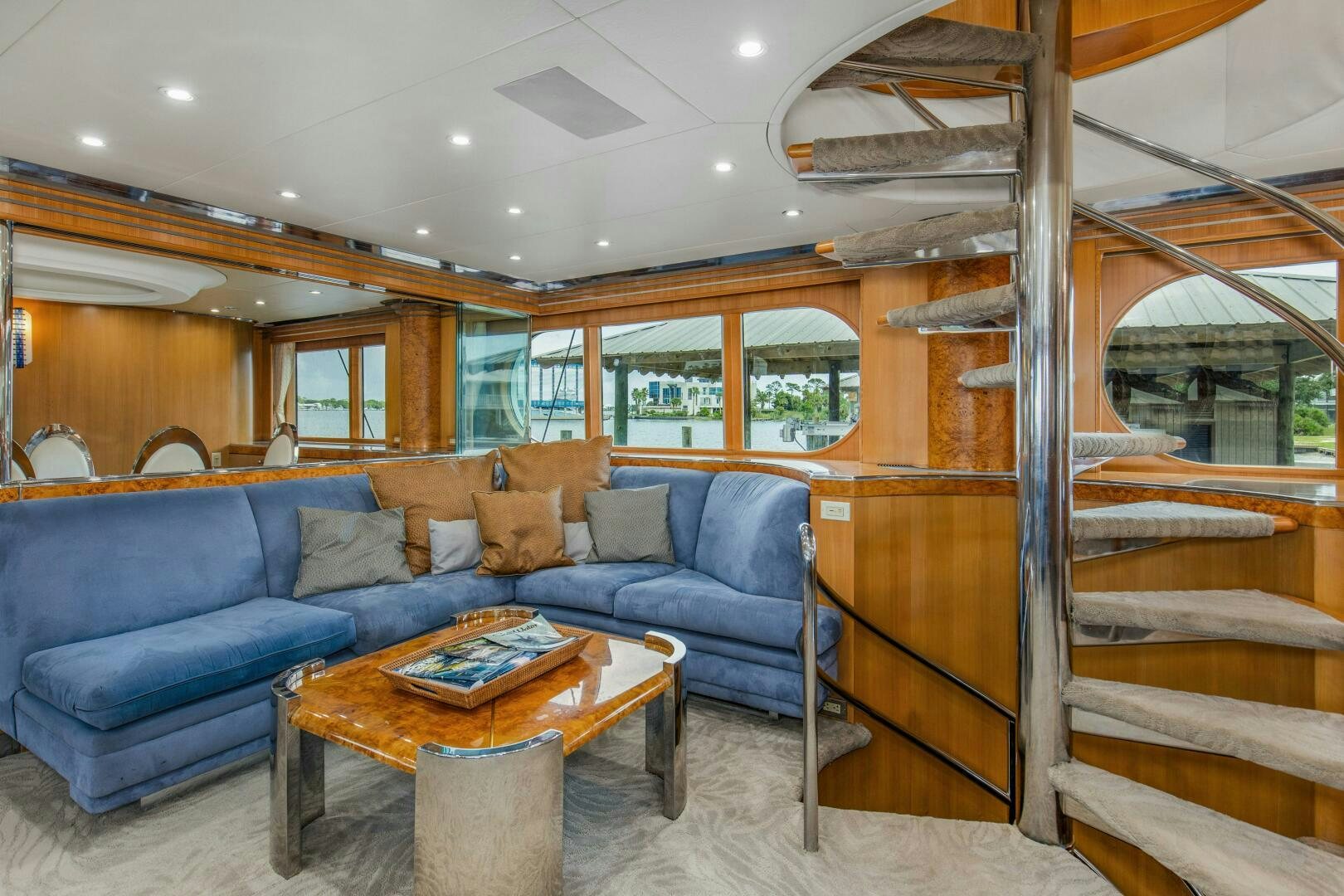 a living room with a couch and a coffee table aboard BOSS Yacht for Sale