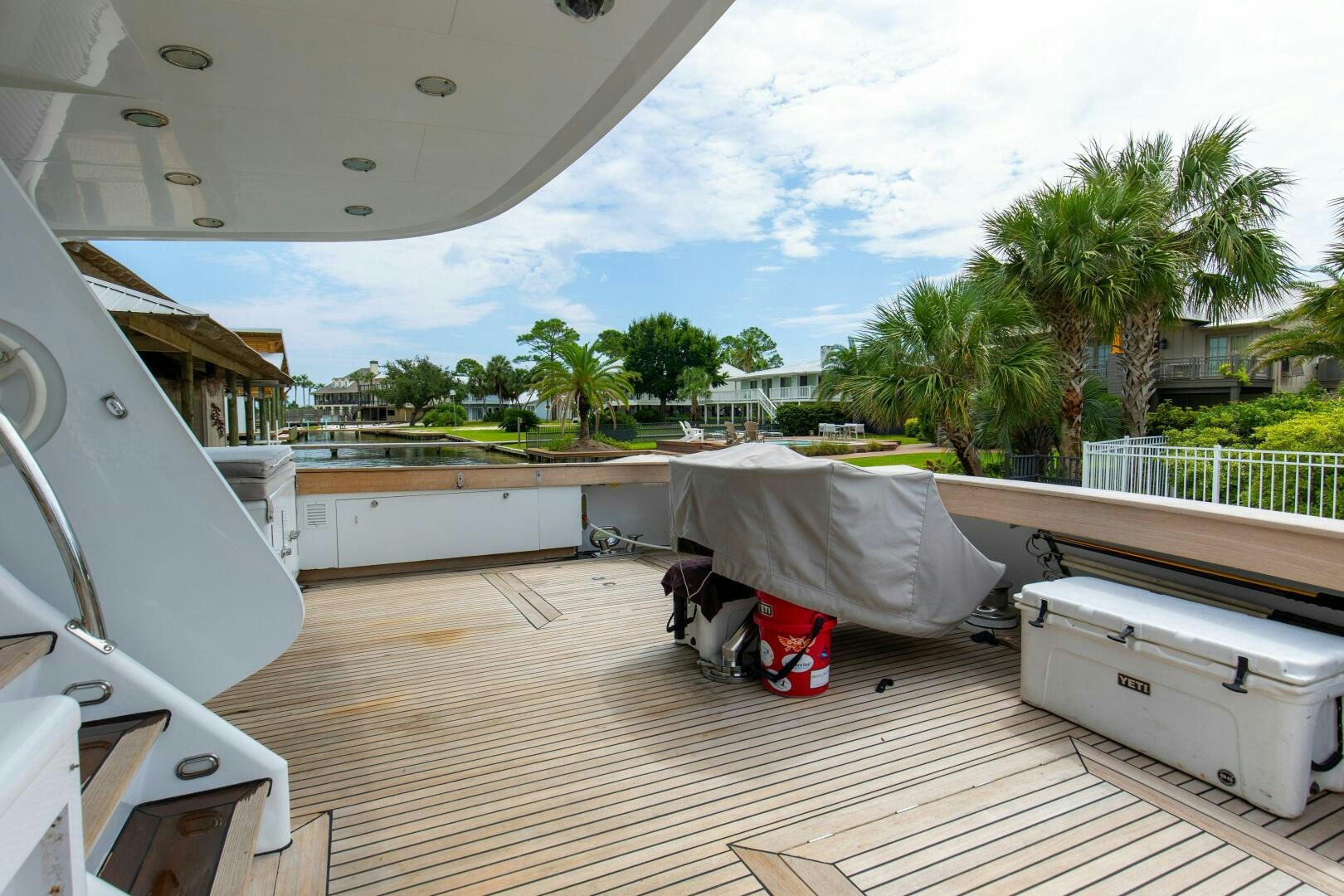 a person lying on a deck aboard BOSS Yacht for Sale