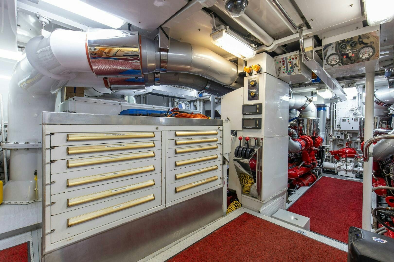 a large machine in a room aboard BOSS Yacht for Sale