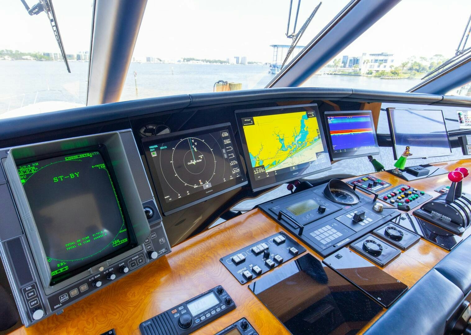 a group of computers on a table aboard BOSS Yacht for Sale