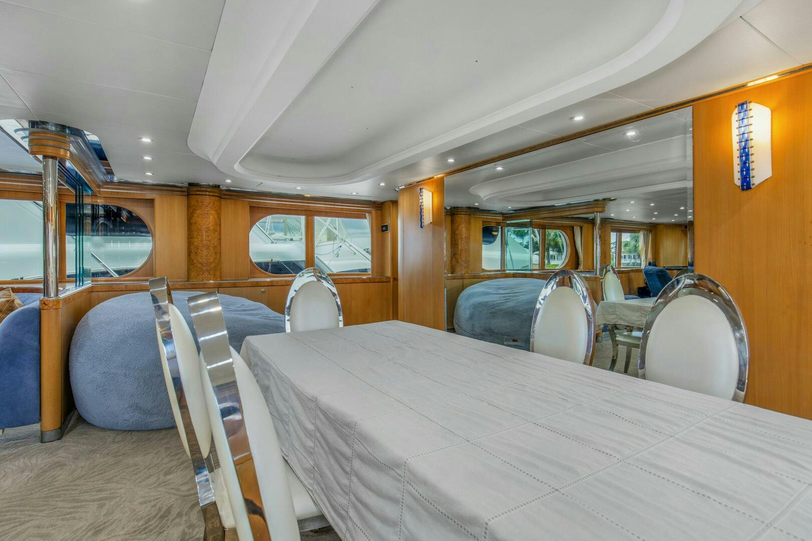 a bus with a table and chairs aboard BOSS Yacht for Sale