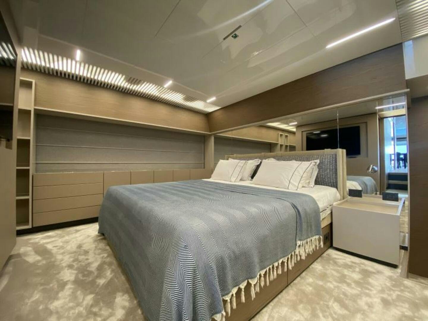 a room with a bed and a television aboard SUNRISE - DELETE Yacht for Sale