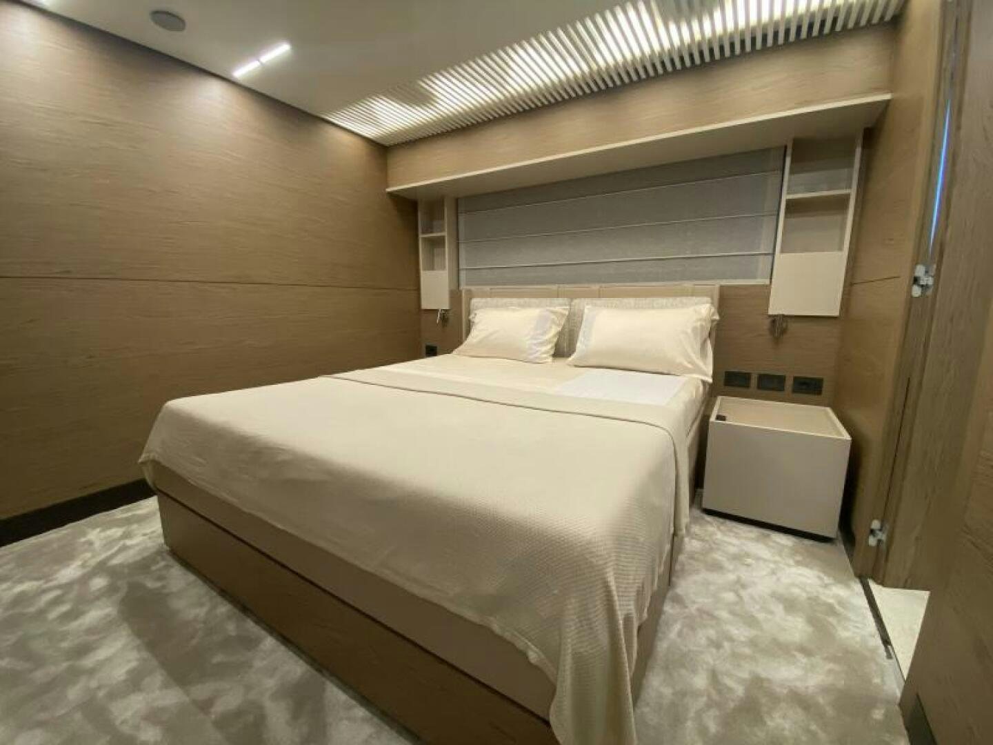 a room with a bed and a desk aboard SUNRISE - DELETE Yacht for Sale