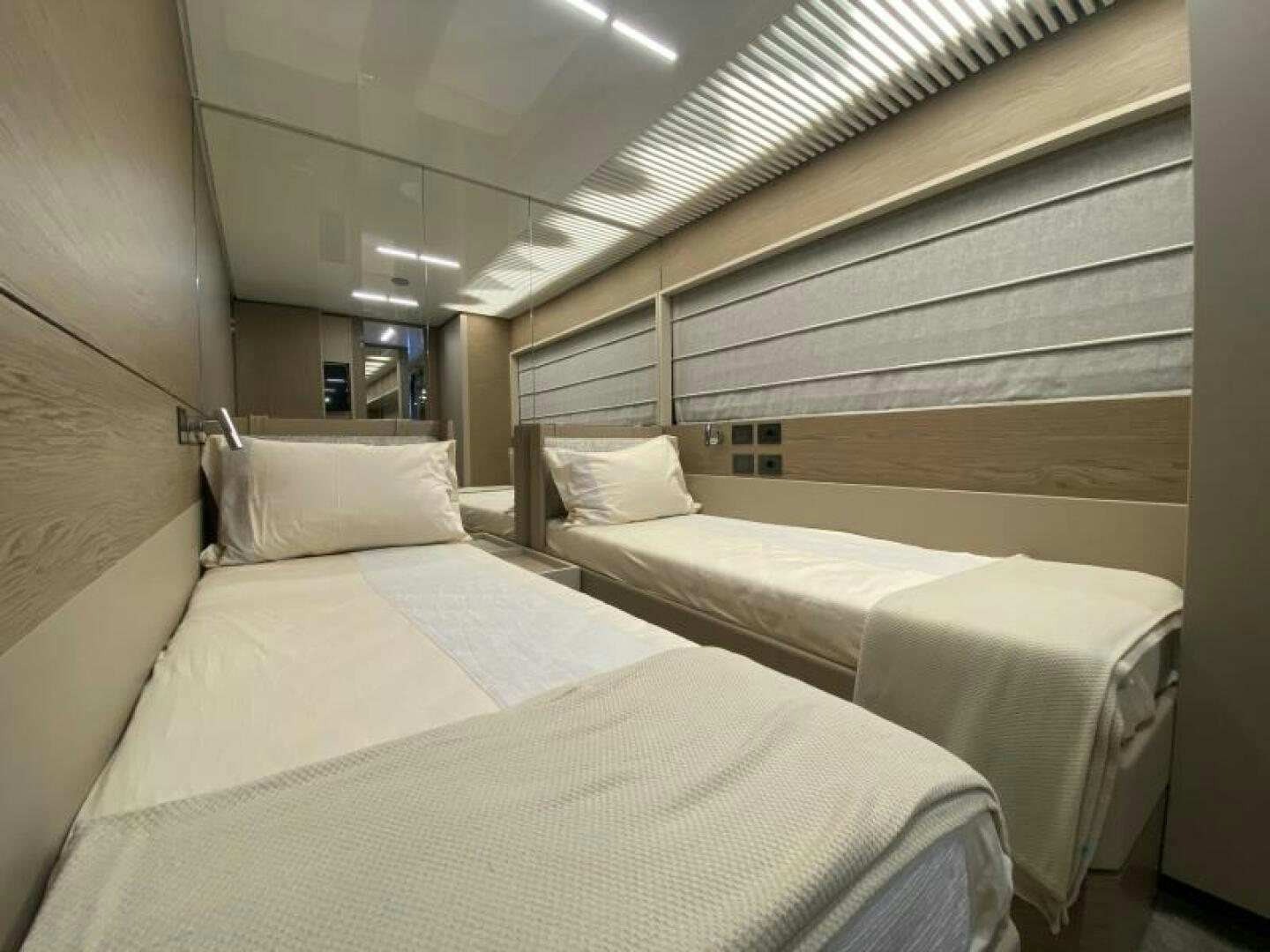 a room with beds in it aboard SUNRISE - DELETE Yacht for Sale
