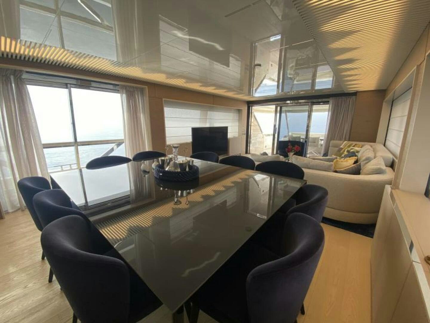 a large room with a table and chairs aboard SUNRISE - DELETE Yacht for Sale