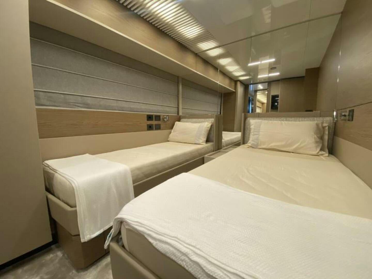 a room with several beds aboard SUNRISE - DELETE Yacht for Sale