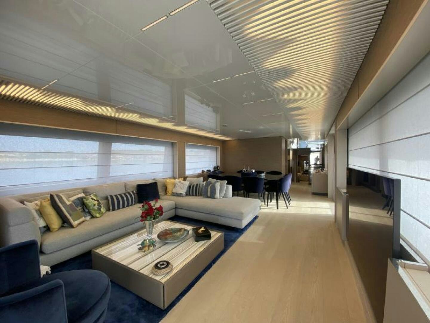 a living room with a couch and a table aboard SUNRISE - DELETE Yacht for Sale