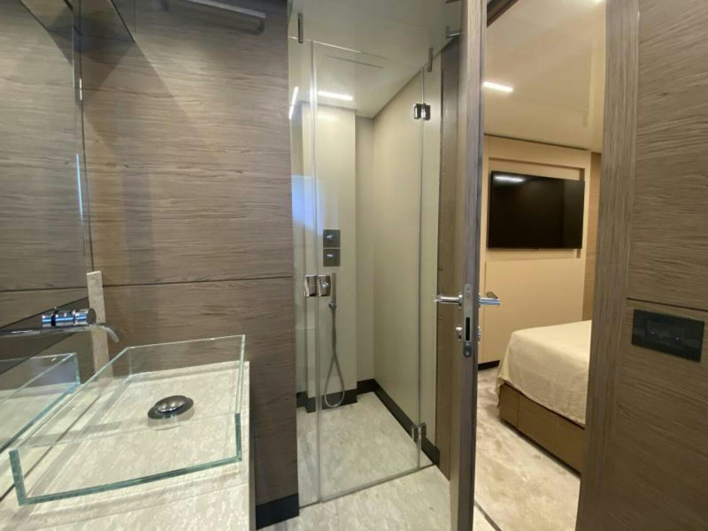 a bathroom with a glass shower aboard SUNRISE - DELETE Yacht for Sale