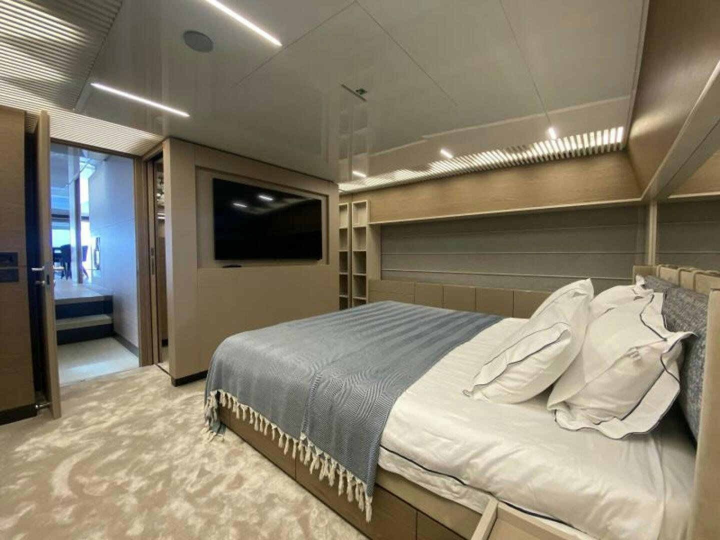a room with a bed and a television aboard SUNRISE - DELETE Yacht for Sale