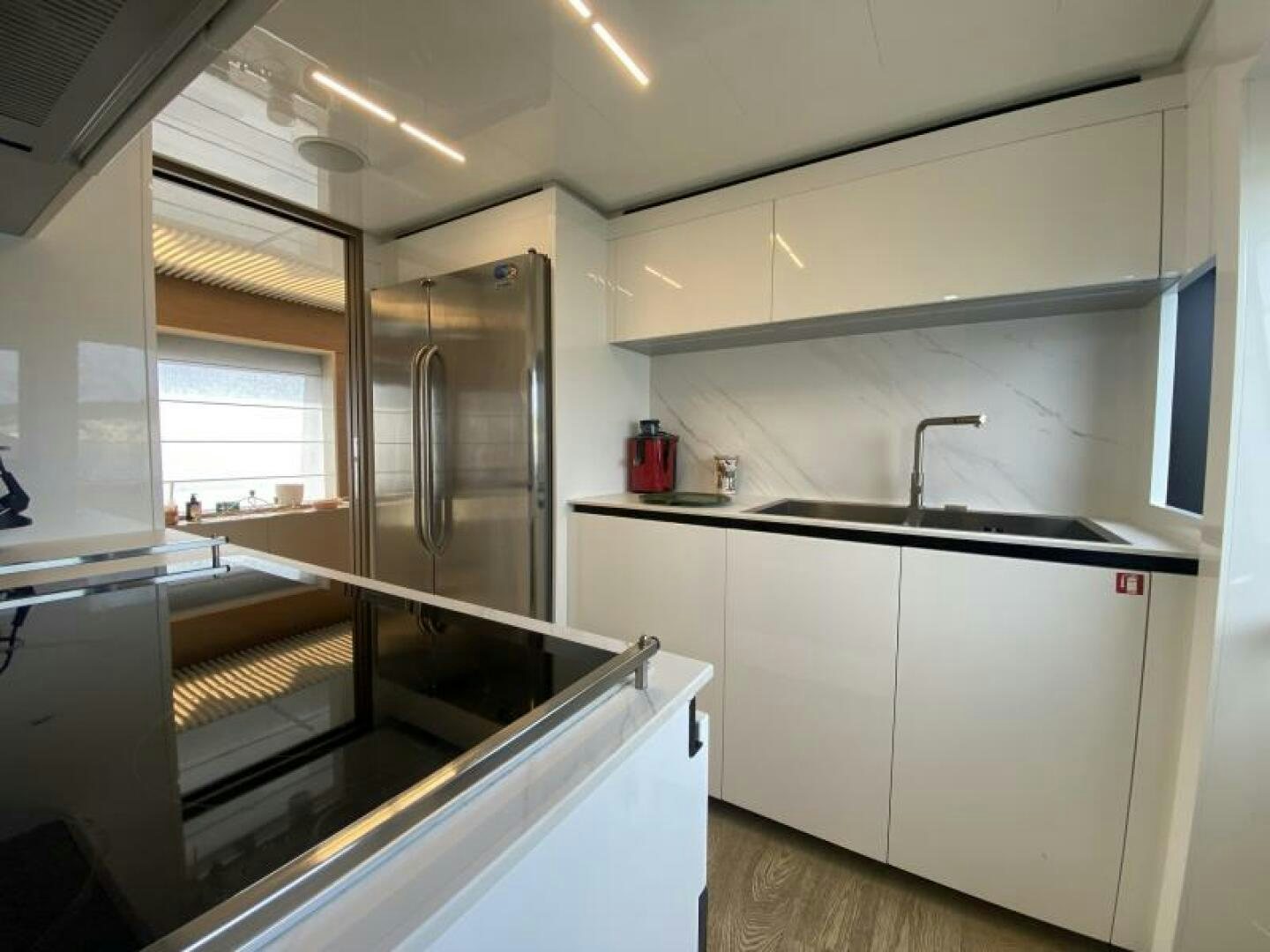 a kitchen with a glass door aboard SUNRISE - DELETE Yacht for Sale