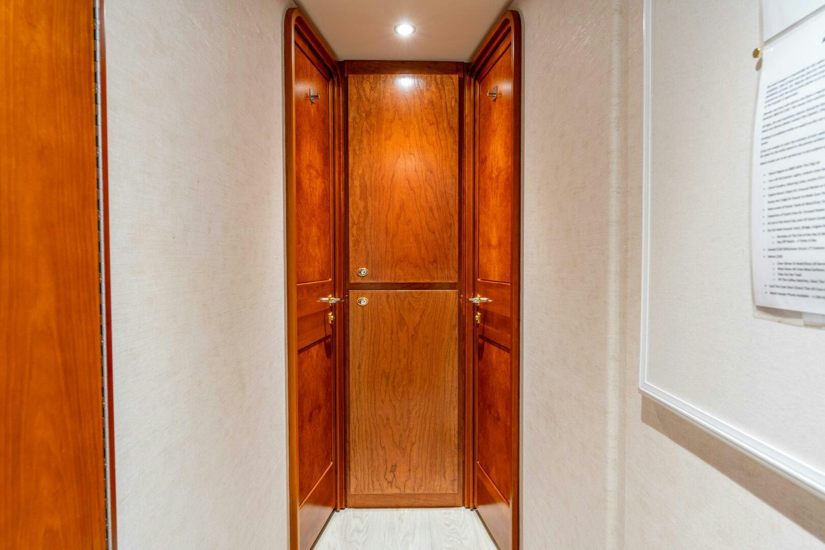 a room with wooden doors aboard RELENTLESS Yacht for Sale