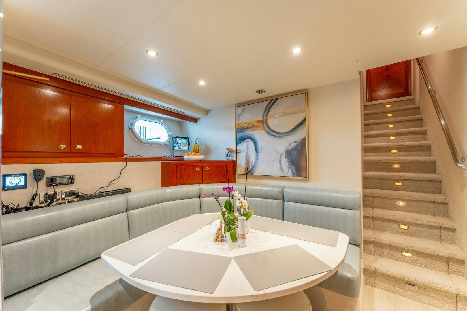 a large kitchen with a large white table and a large window aboard RELENTLESS Yacht for Sale