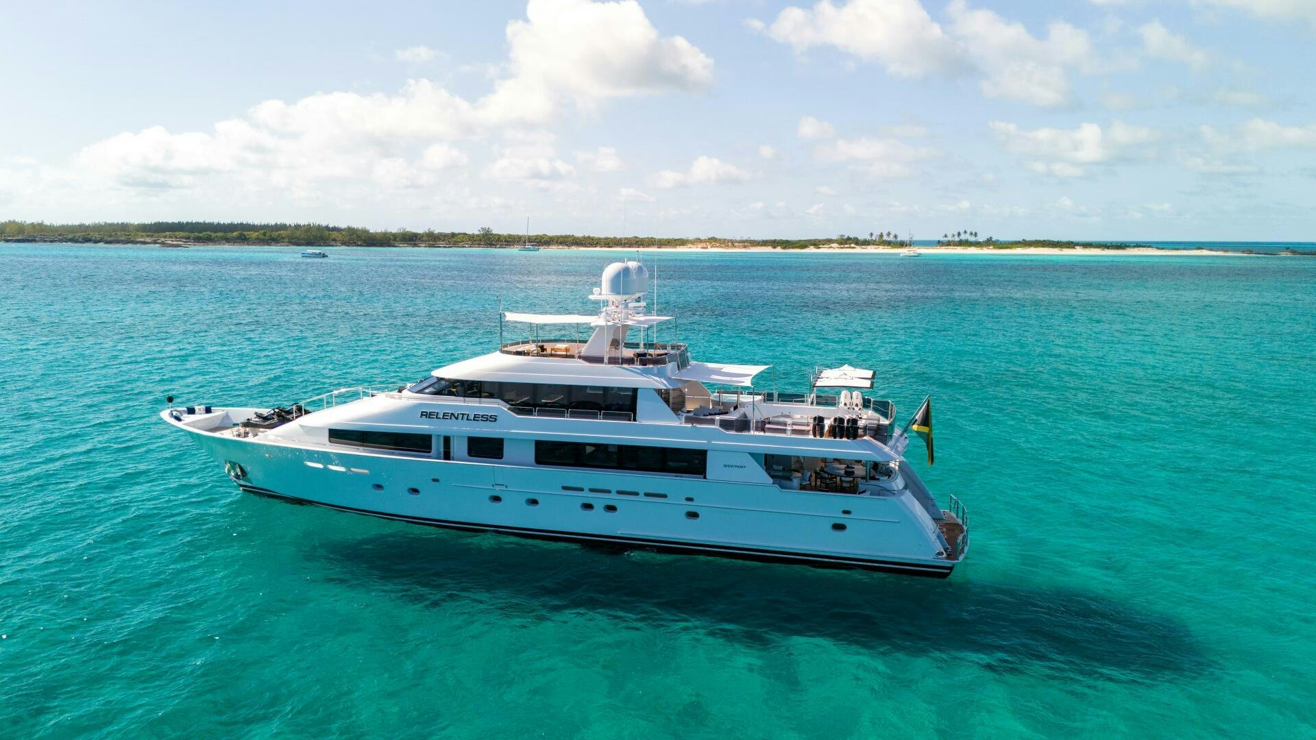 a white boat in the water aboard RELENTLESS Yacht for Sale