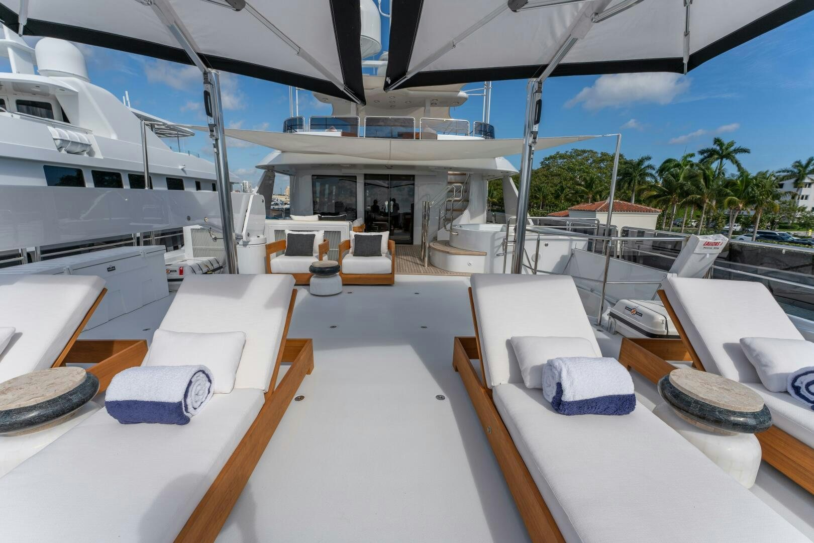 a room with a deck and a pool aboard RELENTLESS Yacht for Sale