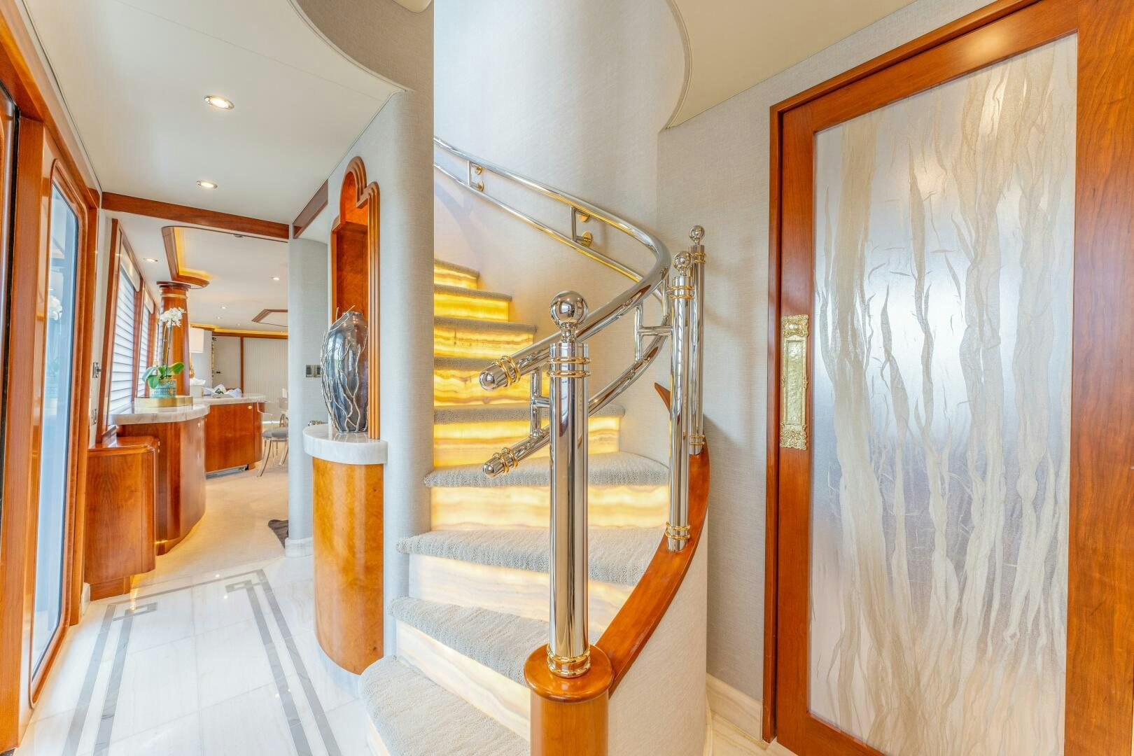 a hallway with a glass railing aboard RELENTLESS Yacht for Sale