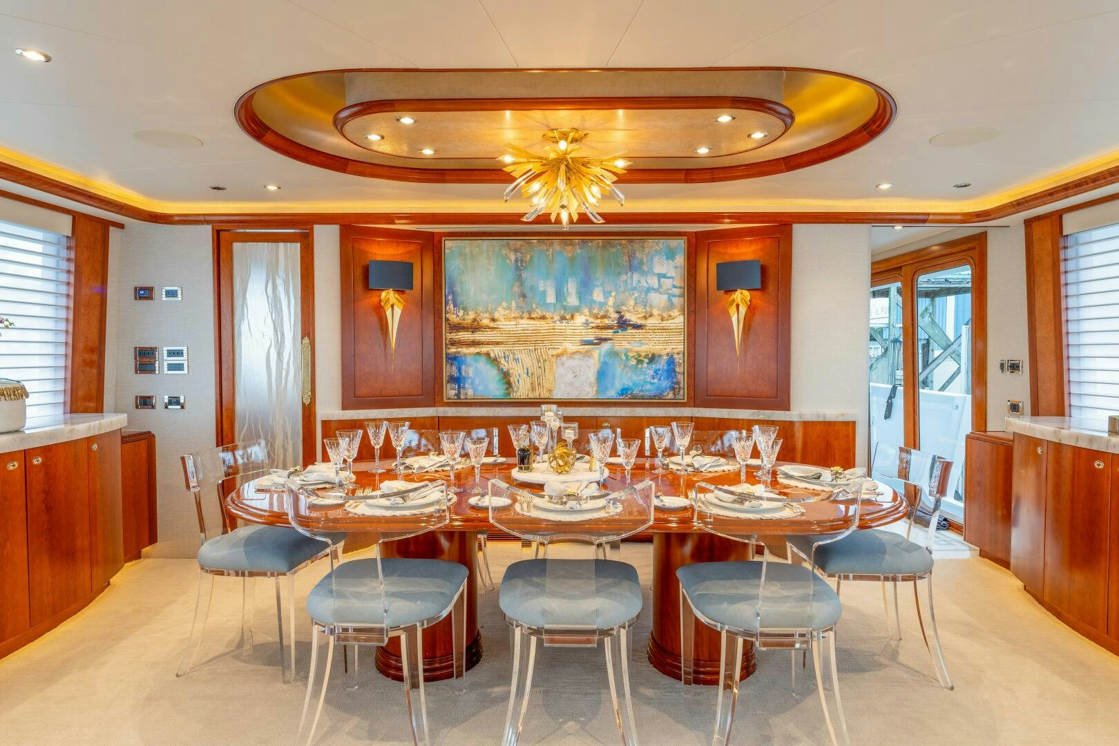 a large room with tables and chairs aboard RELENTLESS Yacht for Sale