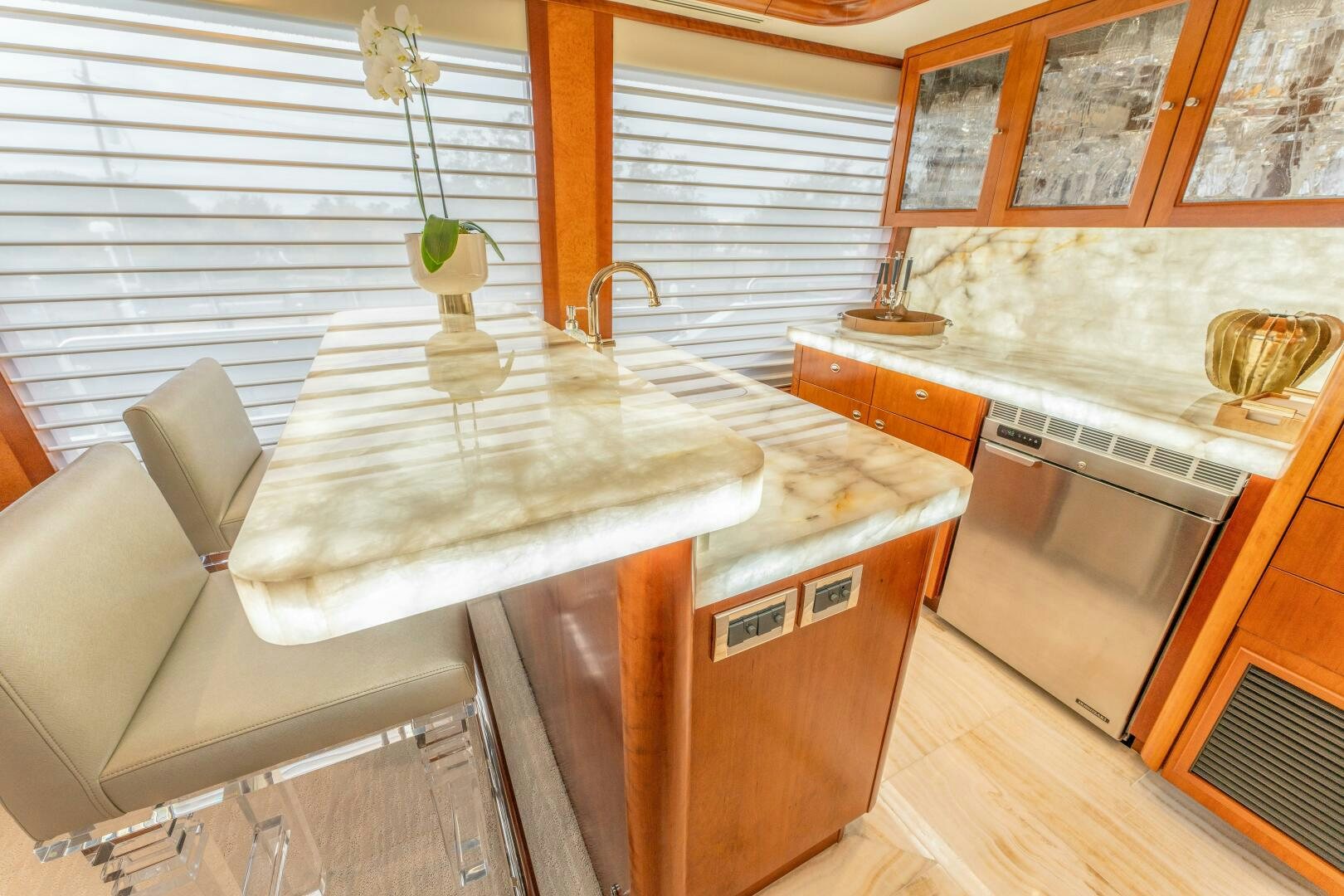 a kitchen with a large island aboard RELENTLESS Yacht for Sale