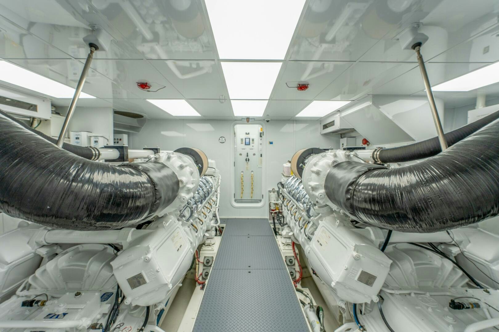 a room with a large tank and pipes aboard RELENTLESS Yacht for Sale