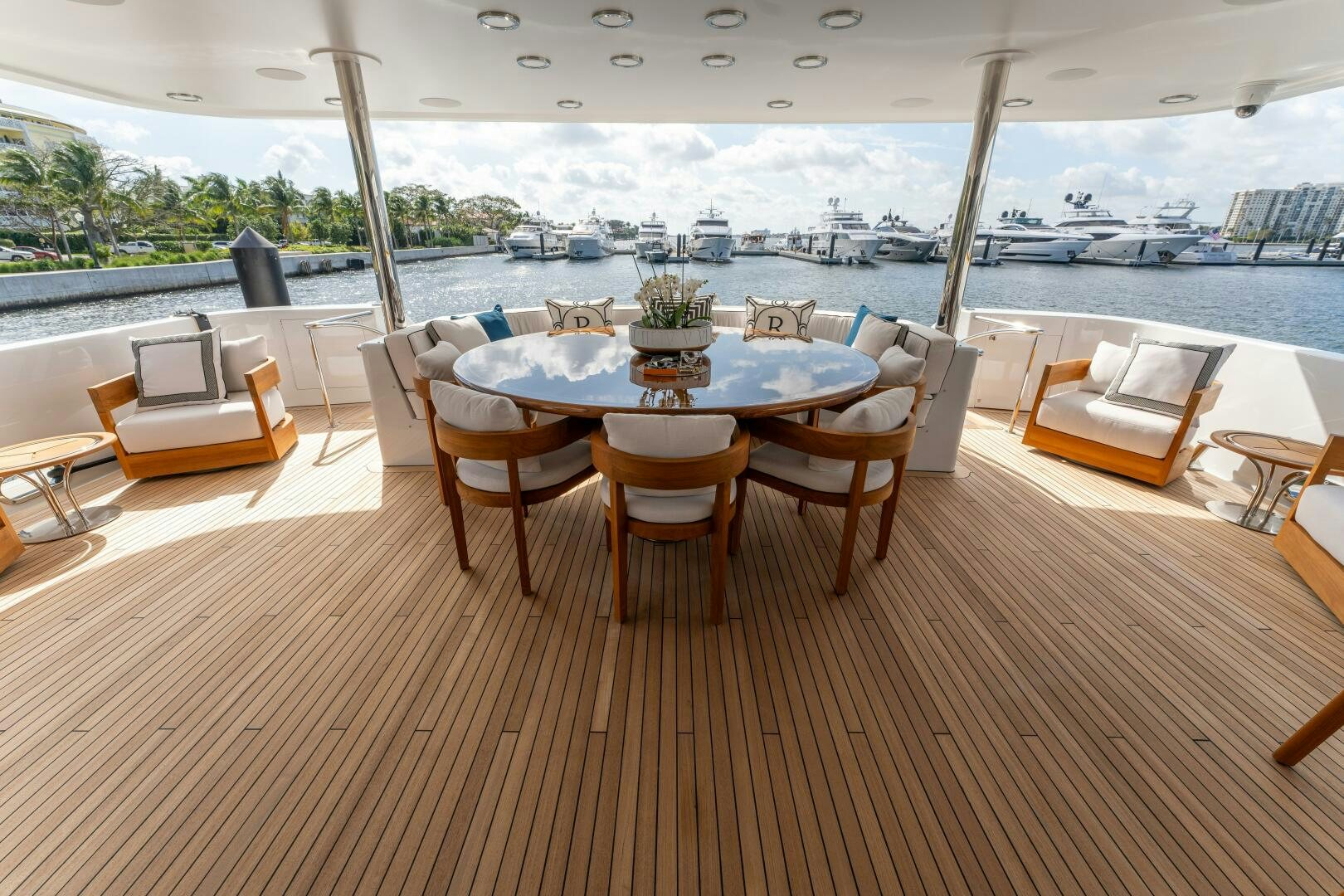 a table with chairs around it aboard RELENTLESS Yacht for Sale
