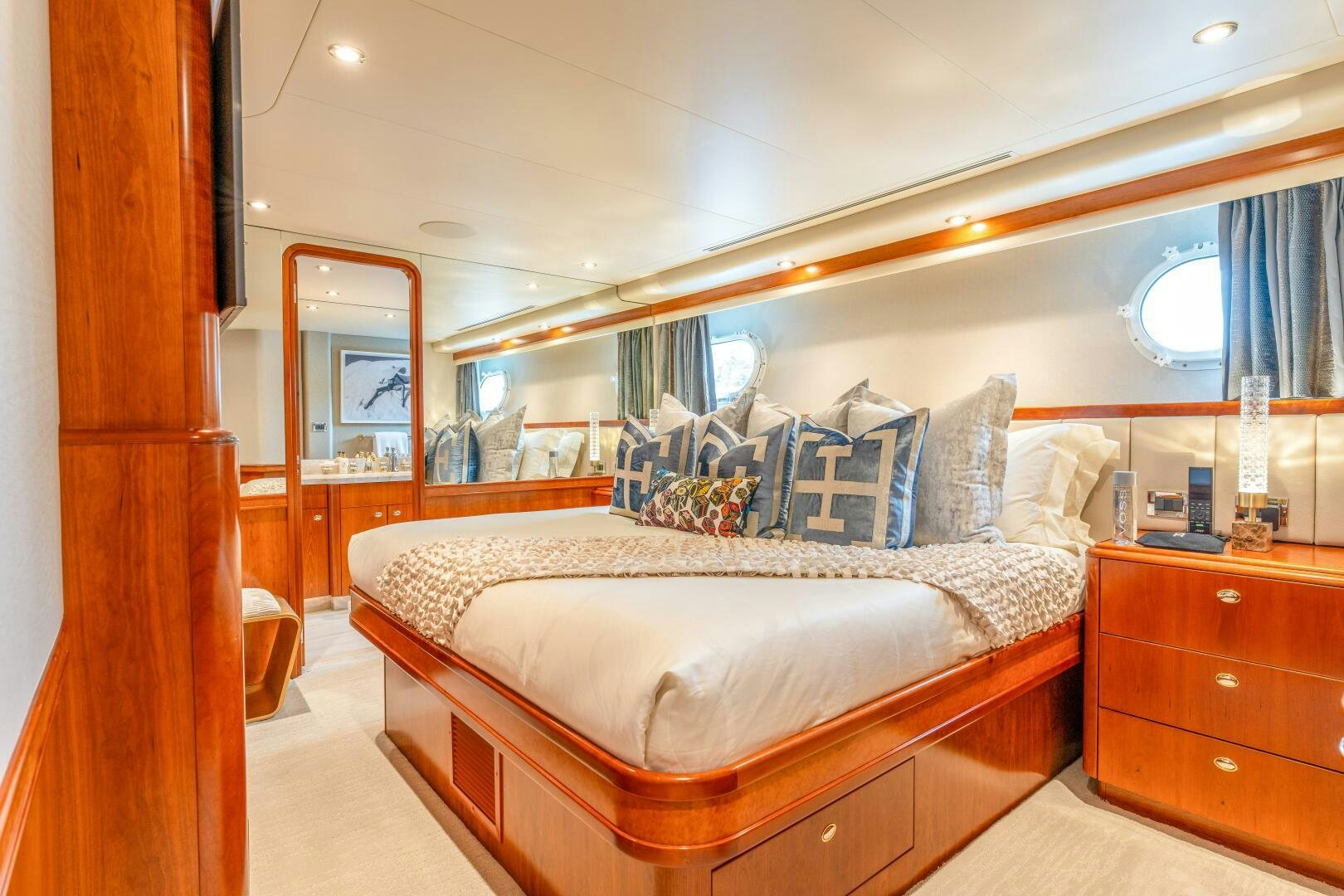 a bed with a white sheet on it aboard RELENTLESS Yacht for Sale