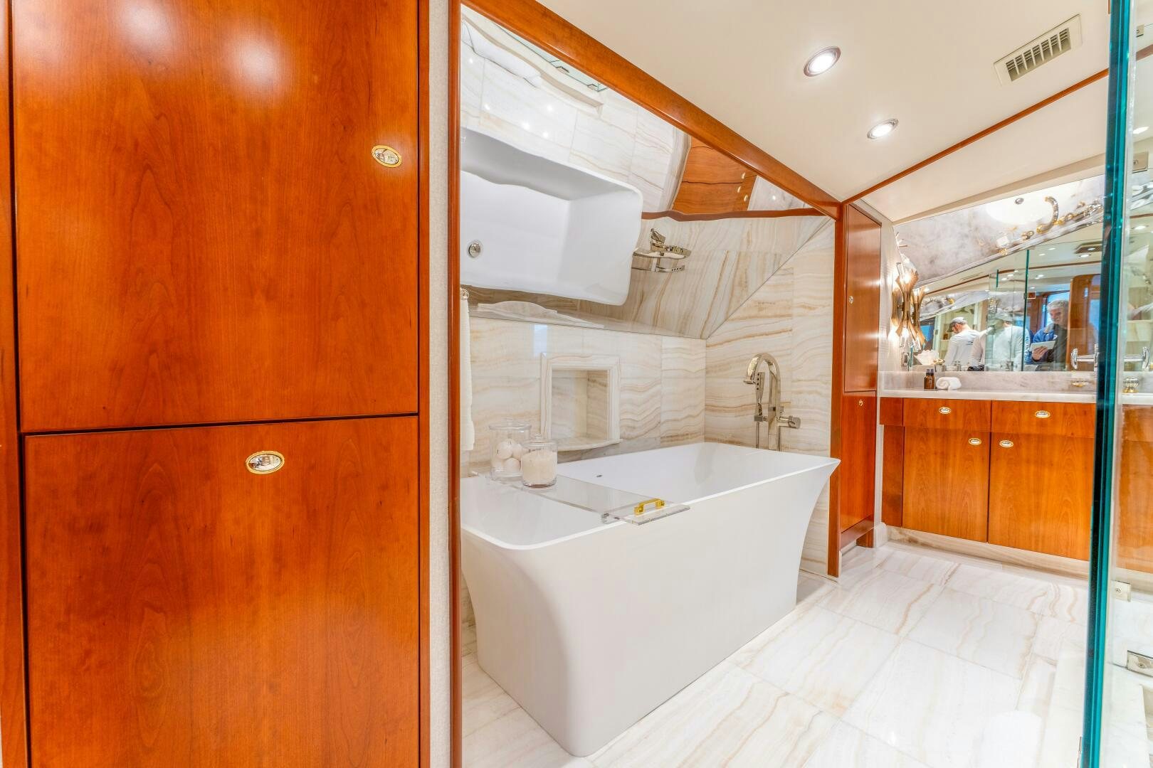 a bathroom with a tub and shower aboard RELENTLESS Yacht for Sale