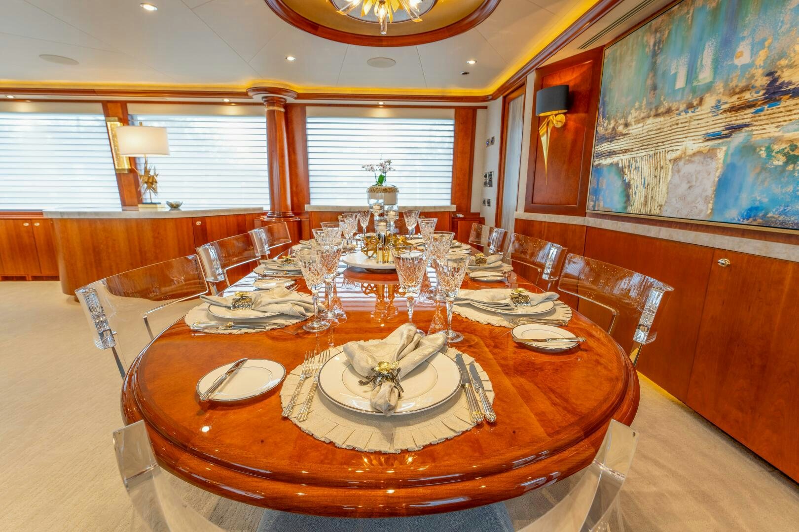 a dining room with a table set aboard RELENTLESS Yacht for Sale