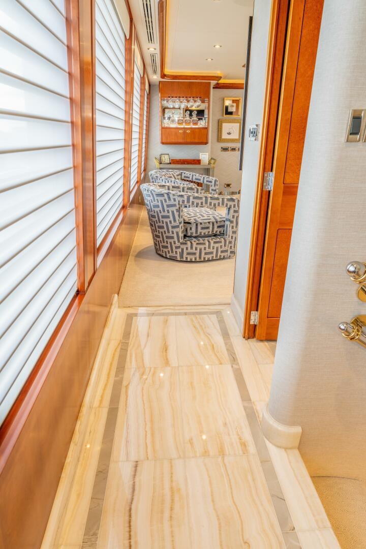 a hallway with a rug and a rug on the floor aboard RELENTLESS Yacht for Sale