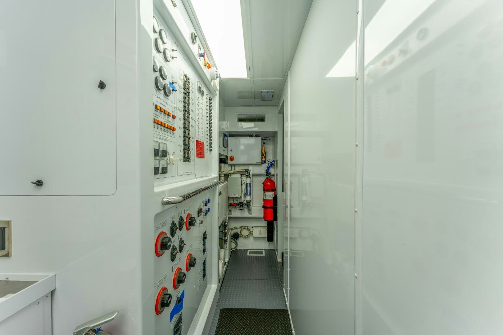 a hallway with white doors aboard RELENTLESS Yacht for Sale