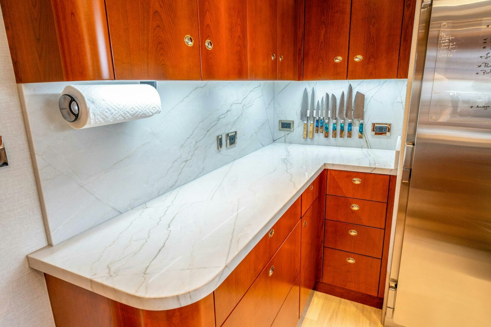 a kitchen counter with a large island aboard RELENTLESS Yacht for Sale